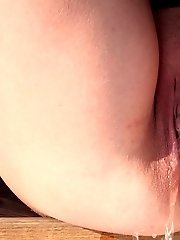 15 pictures - Dark haired babe sprinkles piss on the snow