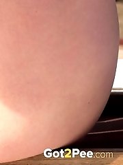 15 pictures - Dark haired babe sprinkles piss on the snow