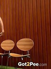 15 pictures - Blonde pissing in a fruit bowl outside