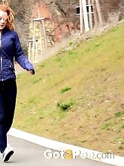 15 pictures - Redhead babe pulls down her denims to piss