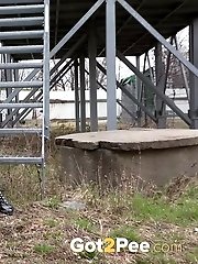 15 pictures - Blonde in denim jeans pisses outside