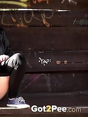 15 pictures - Brunette girl sprays her piss all over the ground