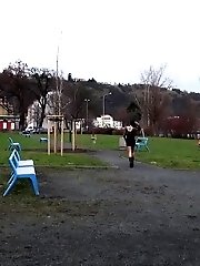 15 pictures - Naughty dark haired babe pees in a public park