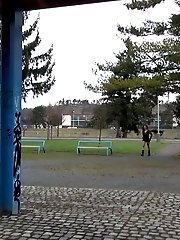 15 pictures - Naughty dark haired babe pees in a public park