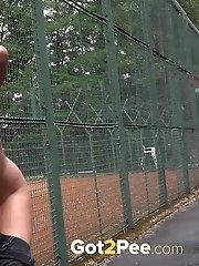 15 pictures - Gorgeous dark haired babe makes a huge piss puddle