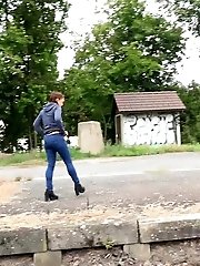 15 pictures - Sexy brunette pisses over the train tracks