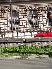 15 pictures - Gorgeous brunette pisses outside a public building