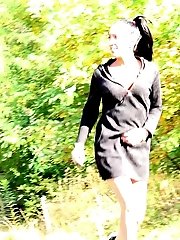 15 pictures - Dark haired babe squats to piss on a road