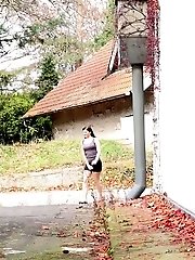 15 pictures - Gorgeous brunette pisses right next to a busy road
