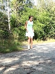 15 pictures - Short haired brunette wipes after pissing outside