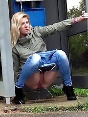 15 pictures - Sexy blonde pulls down her denims and pees