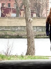 15 pictures - Redhead babe pulls down her denims to piss
