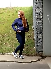 15 pictures - Redhead babe pulls down her denims to piss