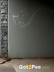 15 pictures - Redhead babe pulls down her denims to piss