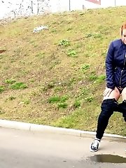 15 pictures - Redhead babe pulls down her denims to piss
