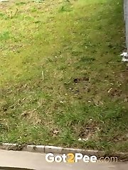 15 pictures - Redhead babe pulls down her denims to piss