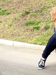 15 pictures - Redhead babe pulls down her denims to piss