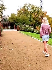 15 pictures - Pretty blonde squats on steps outside to piss