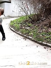15 pictures - Short haired girl pisses in the middle of a path
