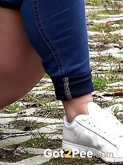 15 pictures - Blonde European pisses on a path on a trail