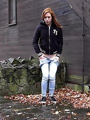 15 pictures - Redhead babe pisses outside on the ground