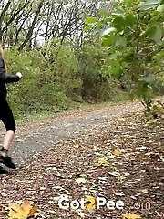 15 pictures - Cute shy girl pisses all over the path outside