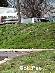 15 pictures - Blonde with bare pussy pisses outside
