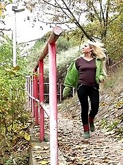 15 pictures - Blonde shows tattoos as she pees outside