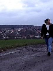 15 pictures - Dark haired babe in denims pees outside