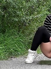 15 pictures - Cute European squatting to pee on a path