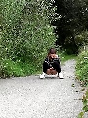 15 pictures - Cute European squatting to pee on a path
