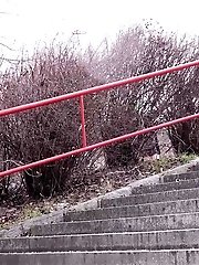 15 pictures - Dark haired hottie pisses down concrete steps