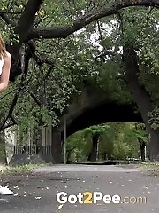 15 pictures - Gorgeous European lifts her leg to piss outside