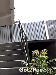 15 pictures - Redhead babe really needs to piss outside