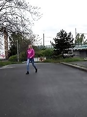 15 pictures - Blonde squats to piss next to a parked car