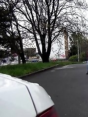 15 pictures - Blonde squats to piss next to a parked car