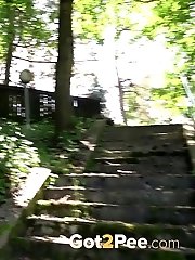 15 pictures - Gorgeous blonde pisses on stone steps