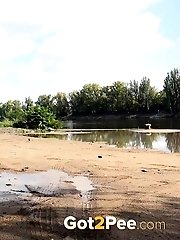 15 pictures - Brunette girl keeps a lookout while pissing