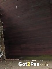 15 pictures - Dark haired babe sprays her piss outside