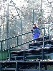 15 pictures - Brunette squats low to piss outside