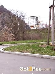 15 pictures - Chubby redhead leaves a puddle of piss behind