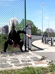 15 pictures - Outdoor pissing for pretty dark haired babe