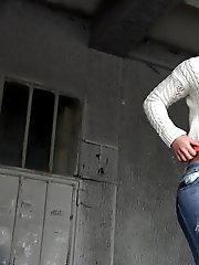 15 pictures - Brunette babe in white sweater pisses outside