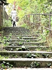 15 pictures - Sexy dark haired girl has a very long piss outside