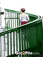 15 pictures - Short haired girl pisses in the middle of a path