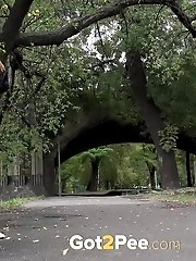 15 pictures - Gorgeous European lifts her leg to piss outside