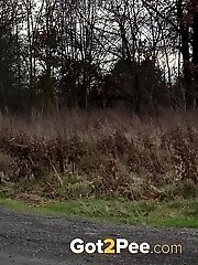 15 pictures - Pregnant brunette pisses on the ground outside