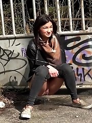 15 pictures - City pissing for stunning black haired babe