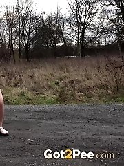 15 pictures - Pregnant brunette pisses on the ground outside