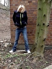 15 pictures - Blonde girl pisses in public as cars drive past